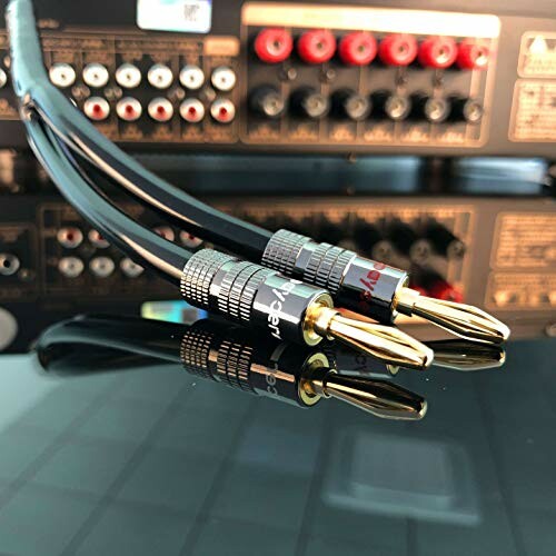 Audio cables connected to a receiver with various input ports.