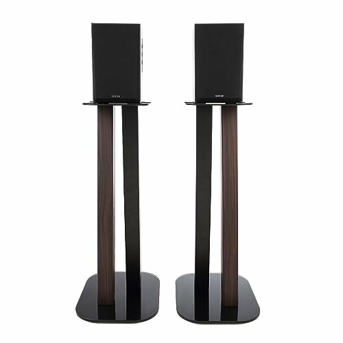 Pair of black speaker stands with wooden accents.