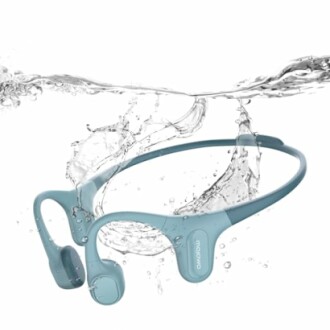 Blue waterproof bone conduction headphones submerged in water.