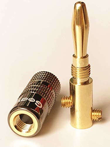 Gold banana plug speaker connector on white background