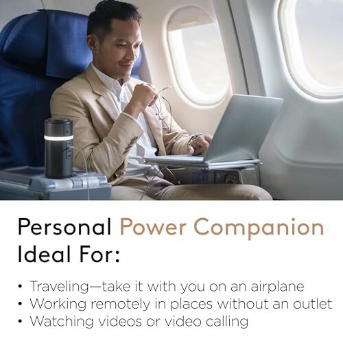 Man using a laptop on an airplane with a personal power companion.