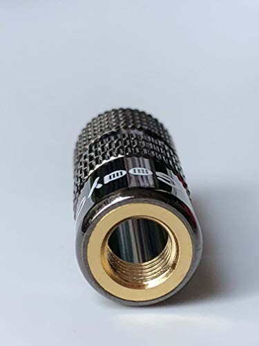 Close-up of a metallic audio adapter with knurled grip.