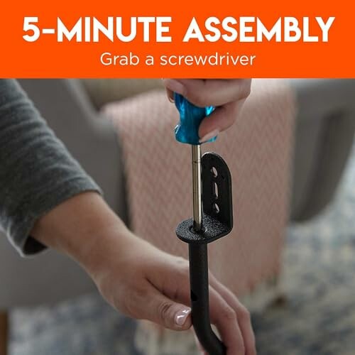 Person using screwdriver for quick assembly.