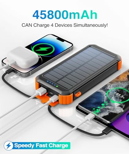 Solar power bank charging multiple devices simultaneously.