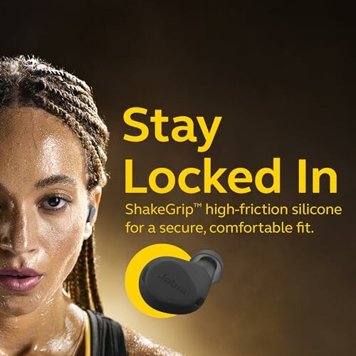 Person wearing earbuds with text promoting ShakeGrip silicone for secure fit.