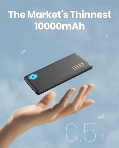 A thin power bank floating above a hand against a blue sky background, symbolizing its lightweight and compact design.